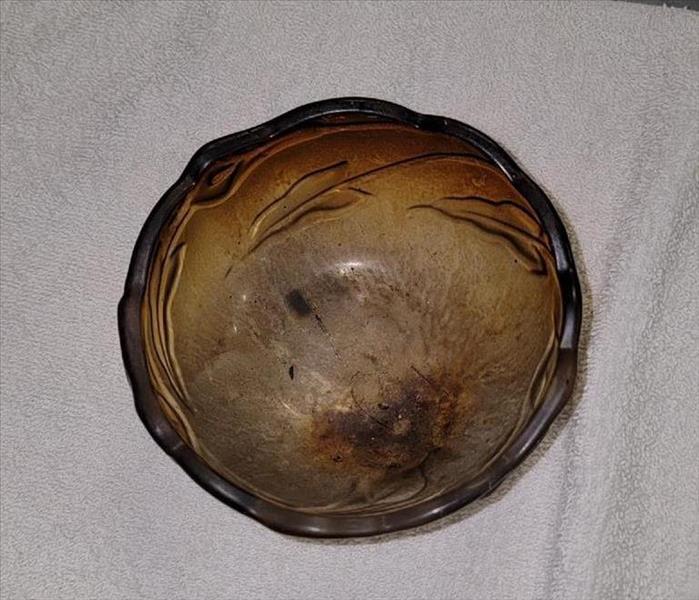 Smoke-damaged bowl before the cleaning process by SERVPRO of North Shasta