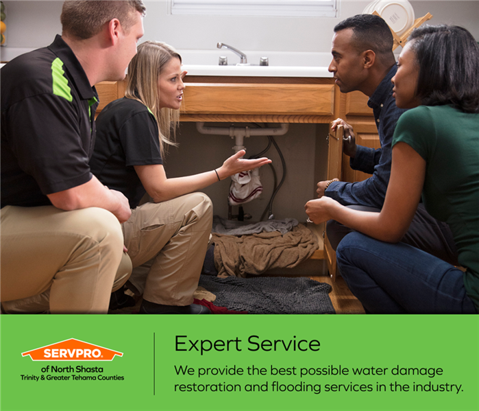 image of SERVPRO technicians assessing water damage